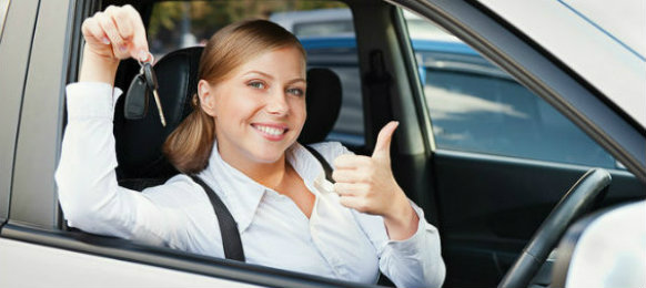 girl-smiling-while-showing-her-car-key-dp