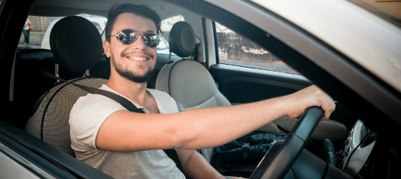 cool guy excited to drive his new car rental