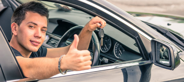 man showing a thumbs up with a car hire key in maidstone